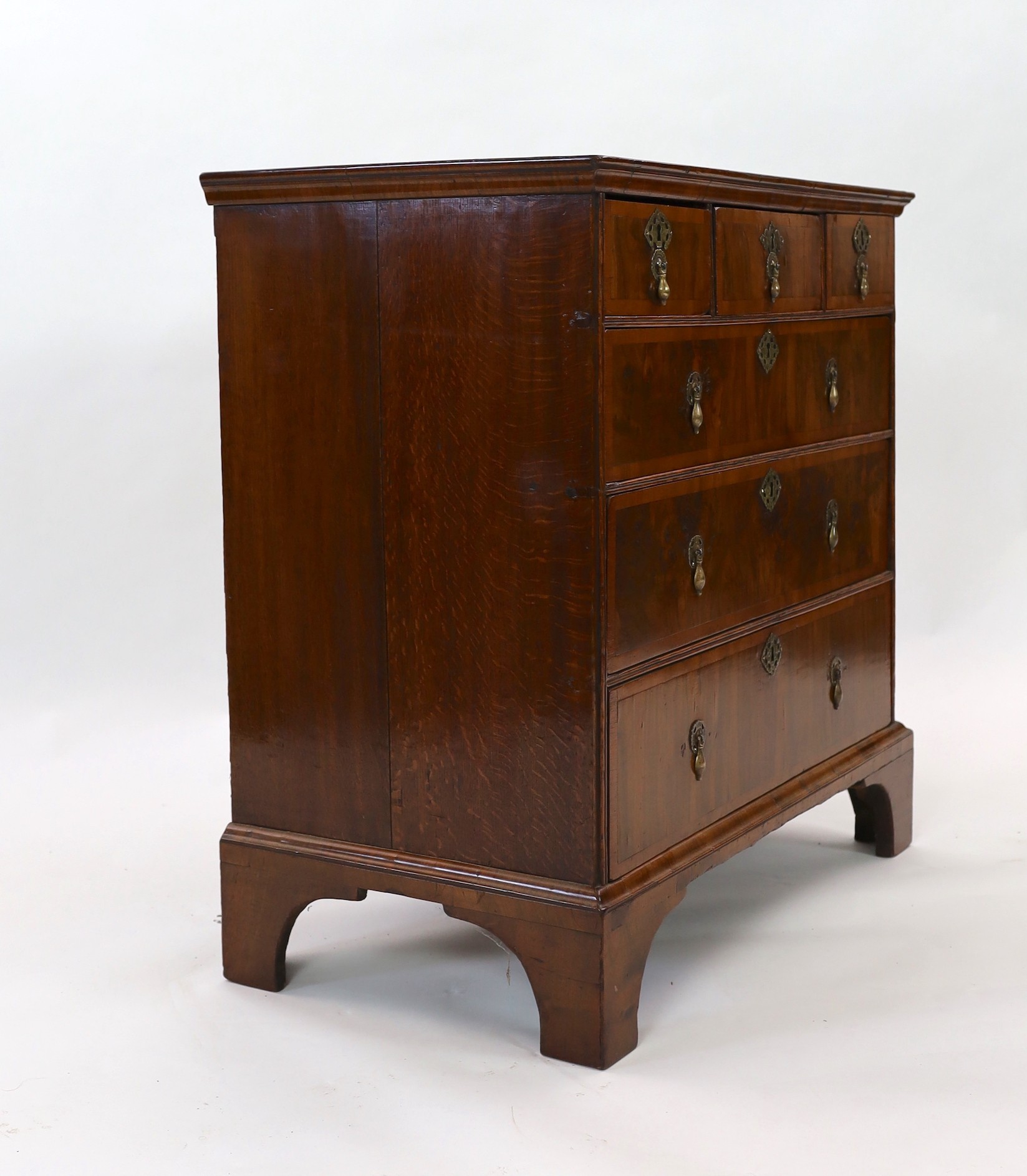 A George I crossbanded walnut chest, width 95cm depth 52cm height 96cm
